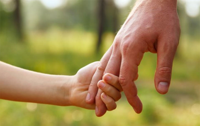 child-and-grown-up-holding-hands
