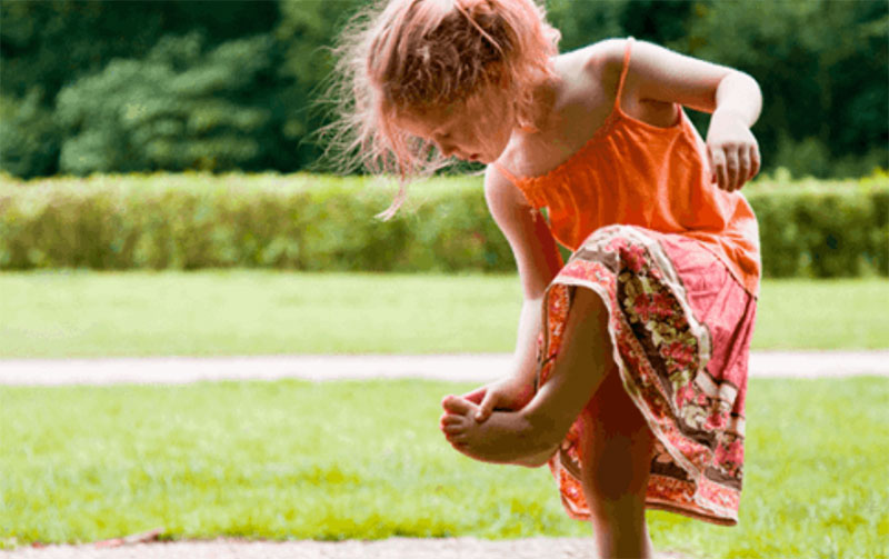 young-girl-looking-under-foot